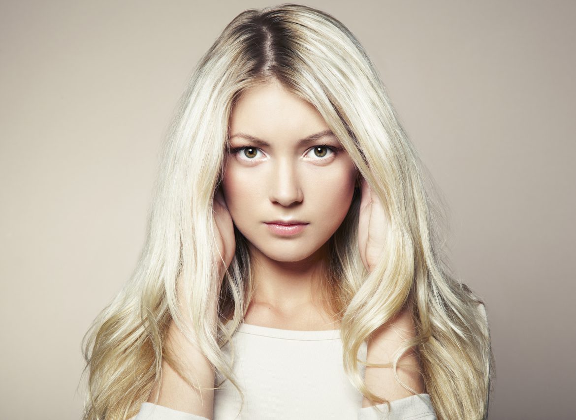 Photo of beautiful woman with magnificent hair. Fashion photo