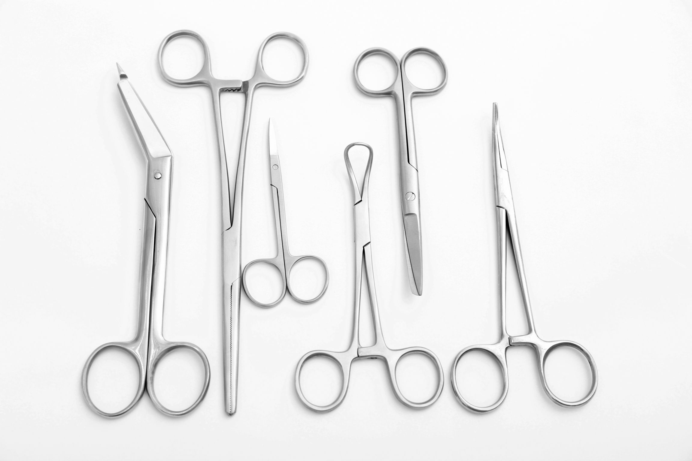 Flat lay of medical instruments on white background
