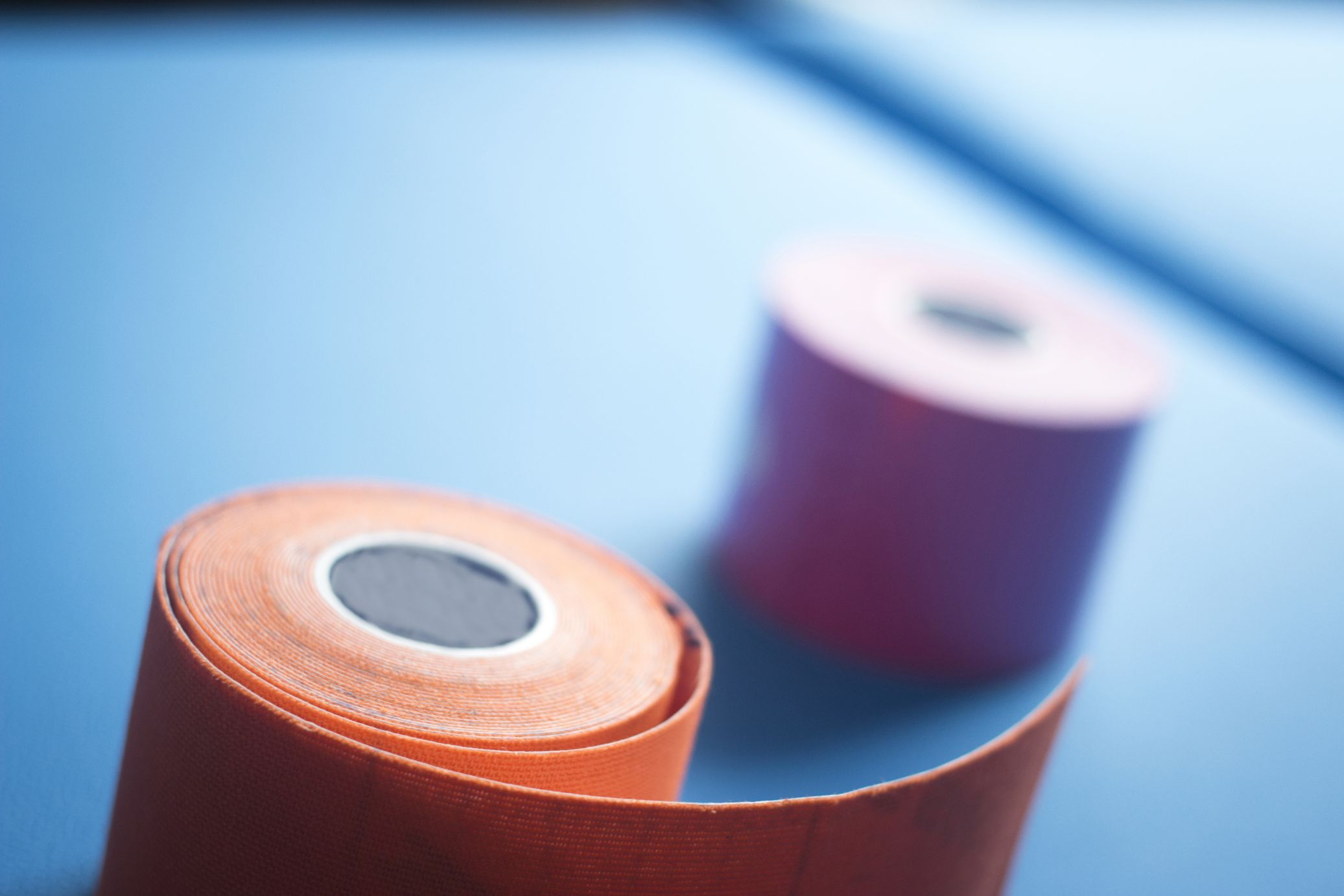 Physiotape physiotherapy color tape bandage kinesiotape rolls for kinesiotaping taping treatment in real life hospital clinic.