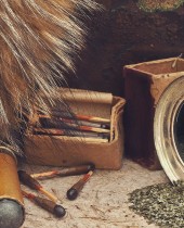 Photo of old matches for hunting with fox brush and gunpowder at beige