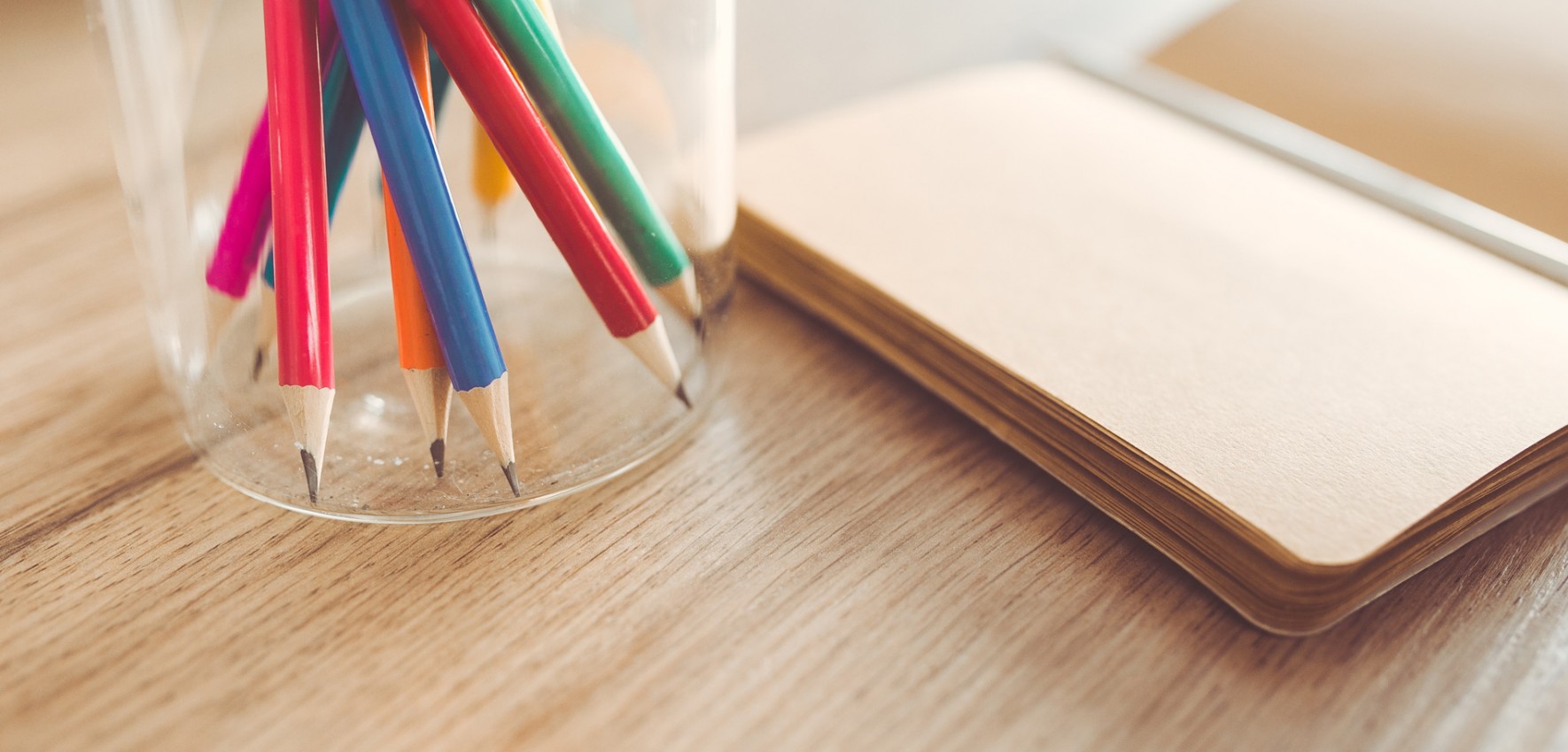 kaboompics.com_Sharp-pencils-and-a-notebook-on-a-table
