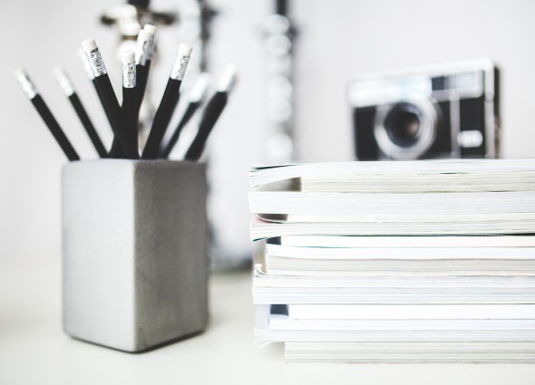 kaboompics.com_Stack-of-magazines-&-pencils-in-gray-cup