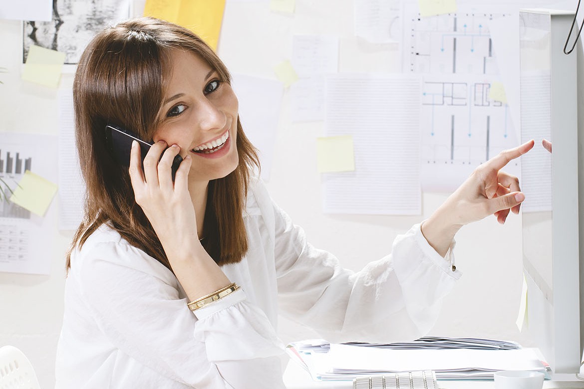 Young businesswoman talking with smartphone.