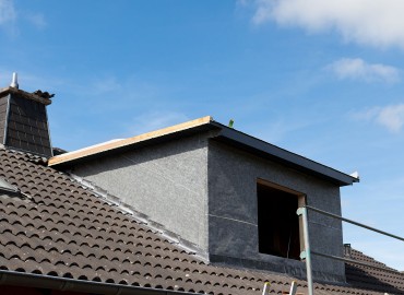 New dormer and scaffolding structure at the construction site