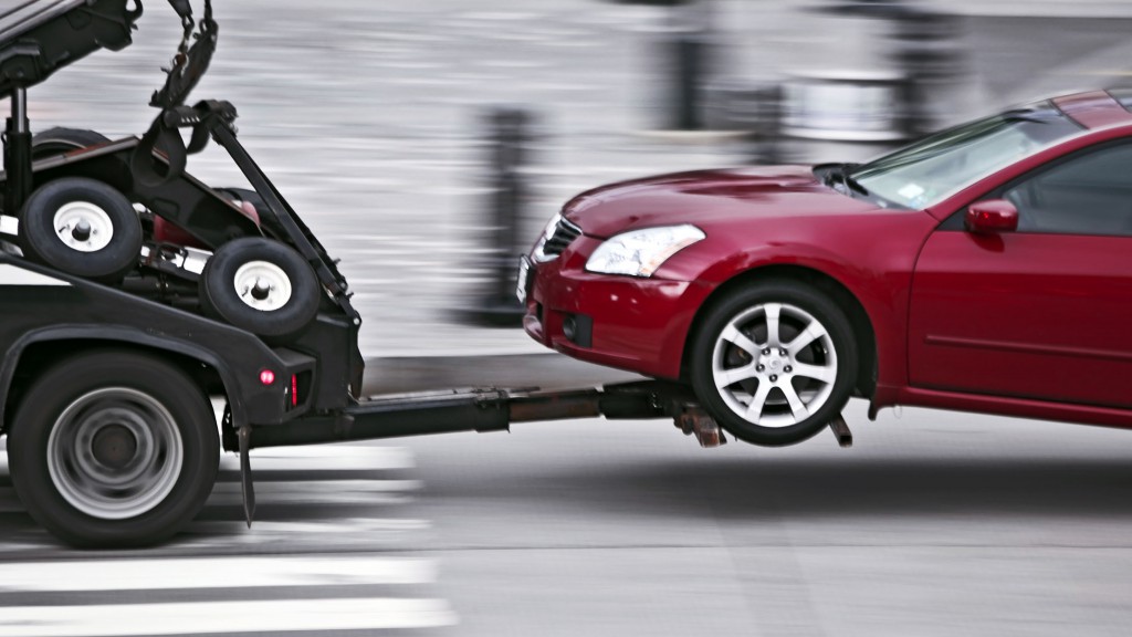 tow truck delivers the damaged vehicle