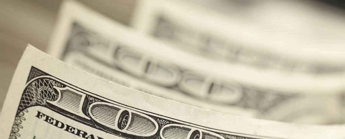 An Abstract of One Hundred Dollar Bills with Narrow Depth of Field.