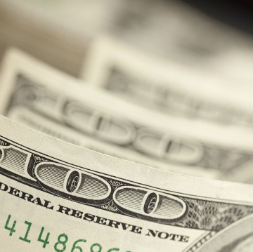 An Abstract of One Hundred Dollar Bills with Narrow Depth of Field.