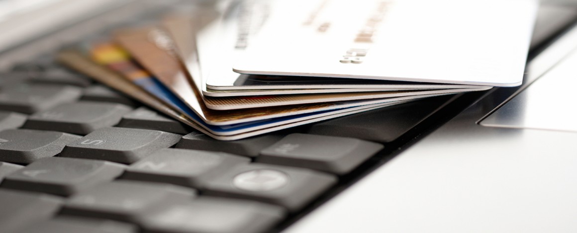 Credit cards and laptop. Shallow DOF