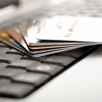 Credit cards and laptop. Shallow DOF