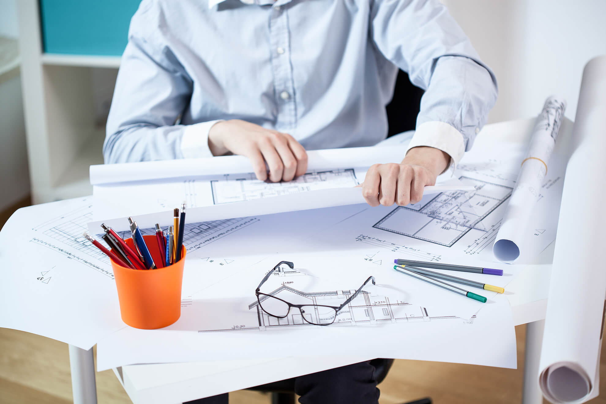 View of man working in architectural office