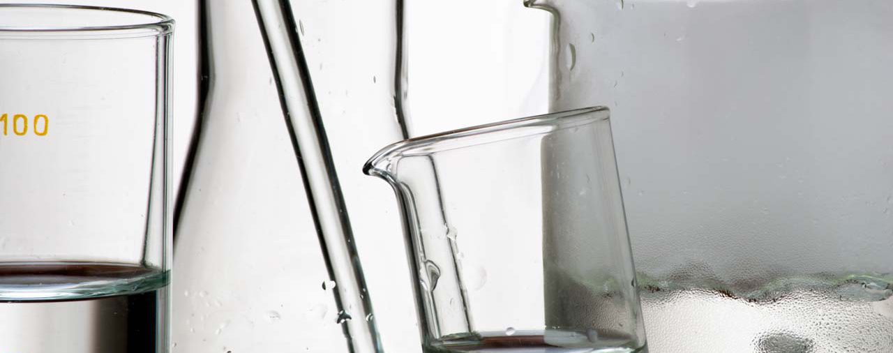 Laboratory glassware during experiment and vapors over liquid
