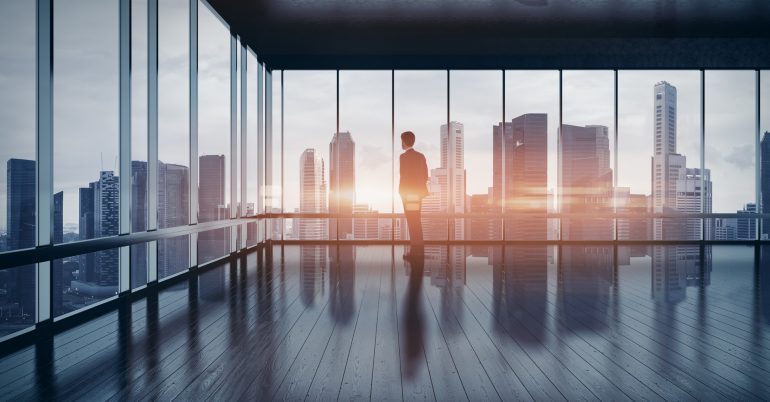 Business man in suit looking at the city