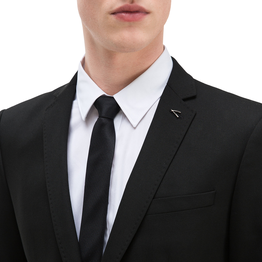 Basic suit. Chest pocket detail. Classic button fastening. Pin lapel detail. 2